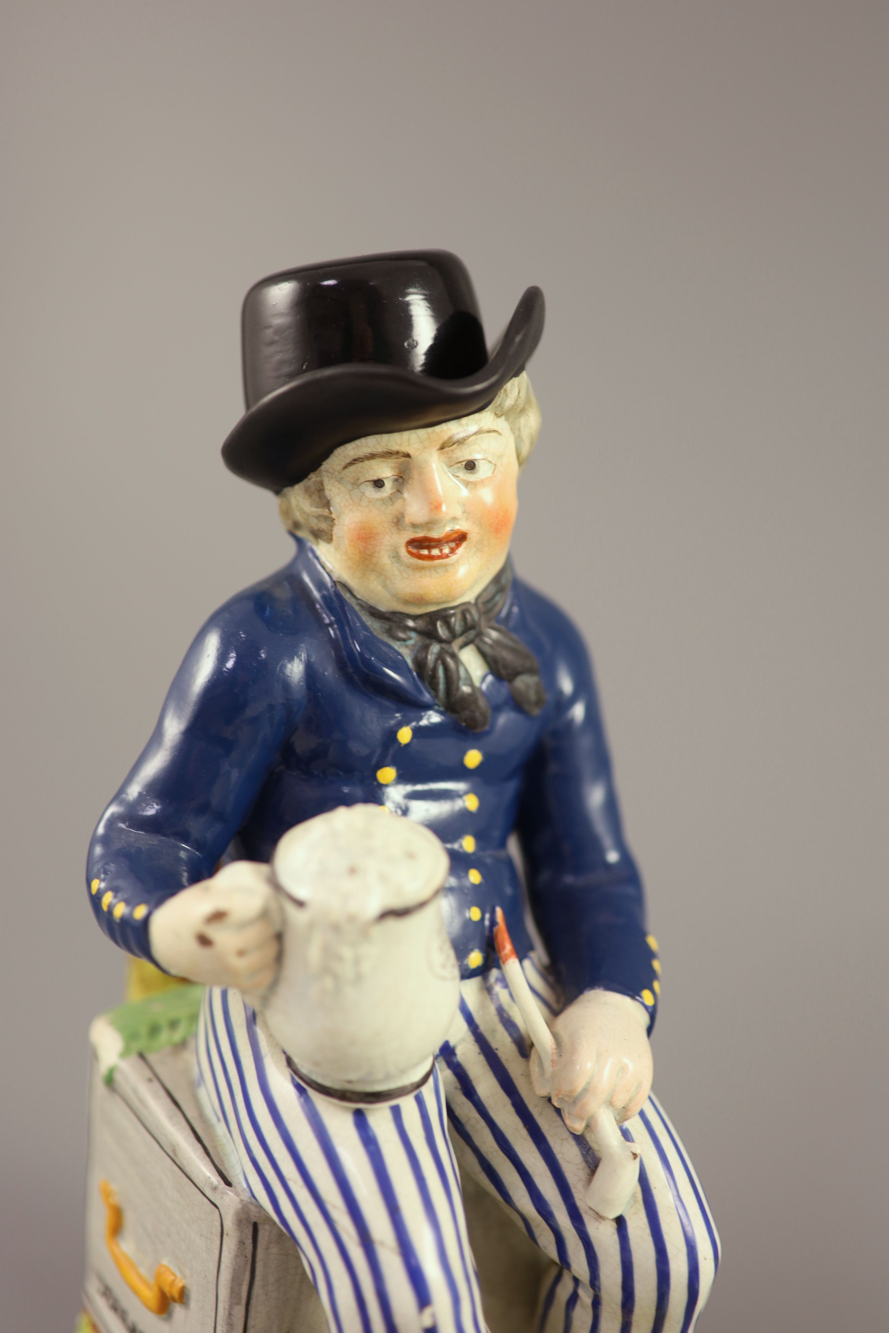 An American Pearlware sailor Toby jug with hat, Success to our Wooden Walls, c.1820, 27cm high